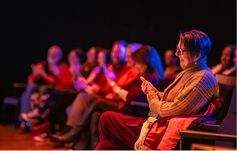 Audience laughing during a comedy performance