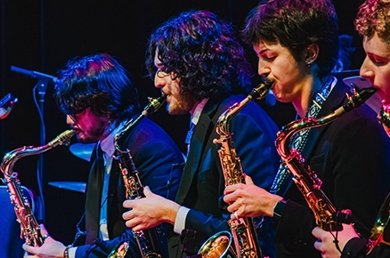 Jazz ensemble with saxophones on stage
